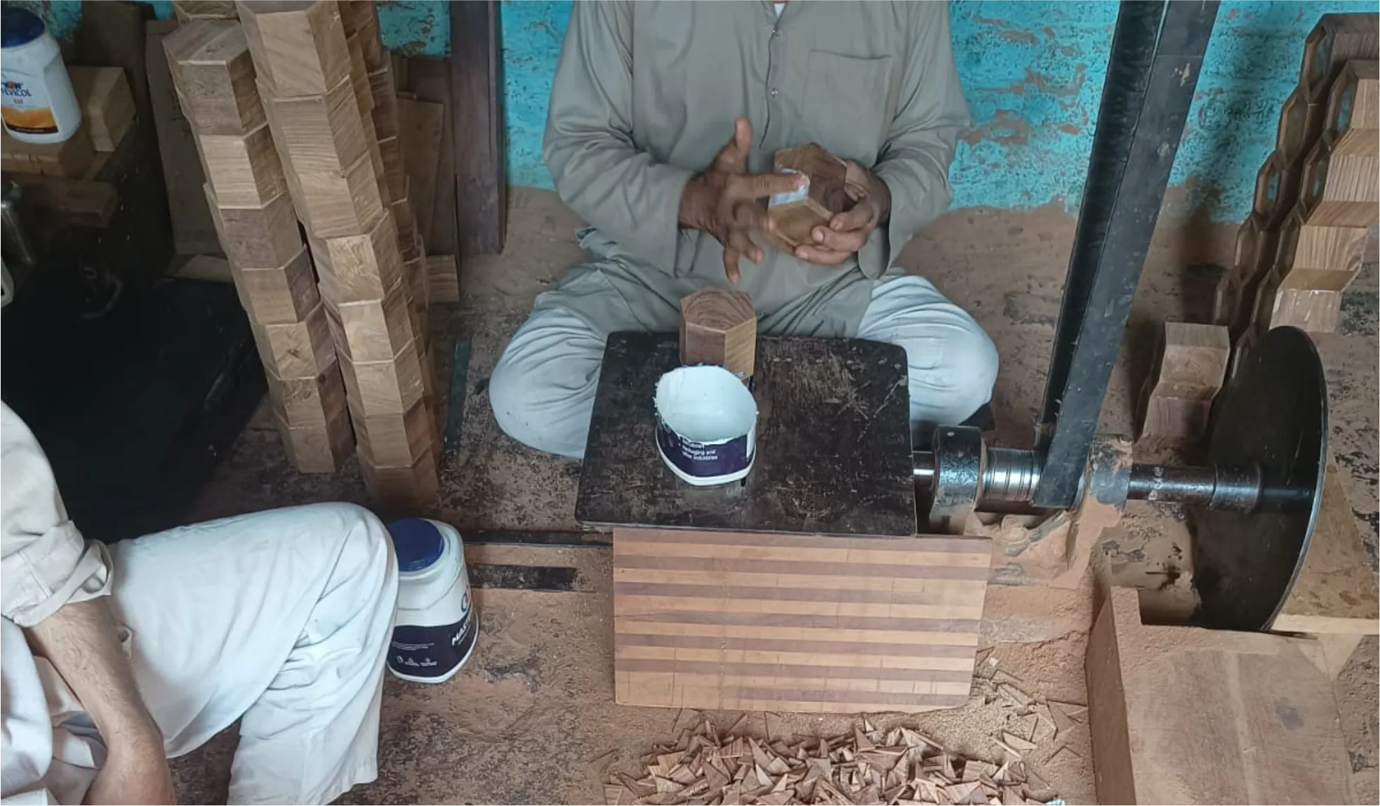 Craftsman turning wood on a lathe
